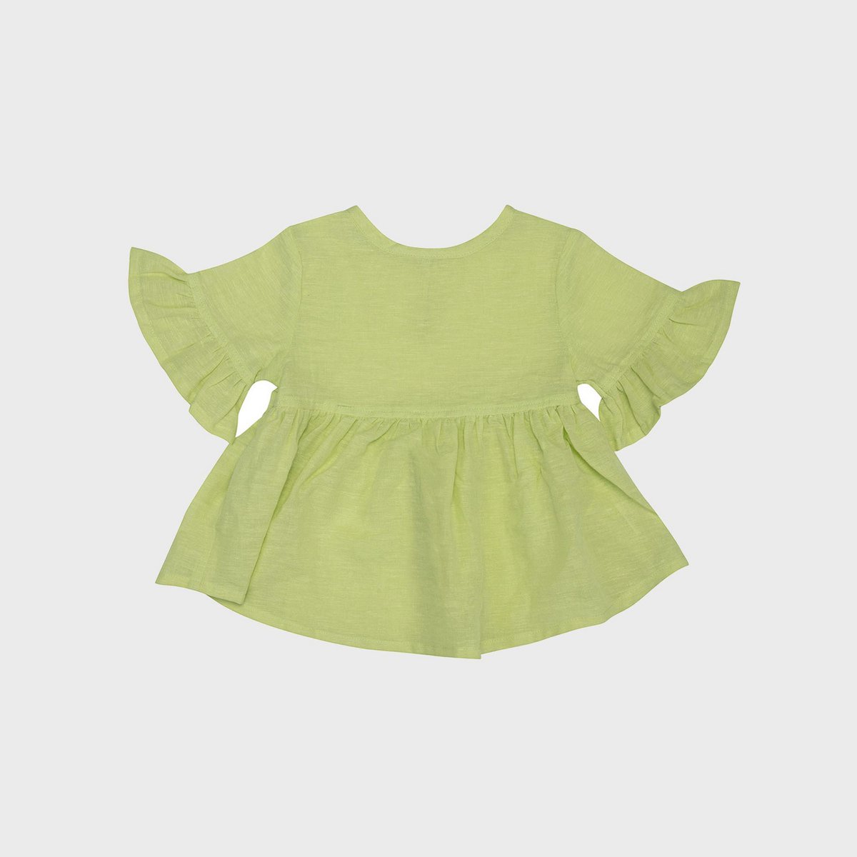 Apfelgrüne Bio Babybluse aus Hanf-Baumwolle.