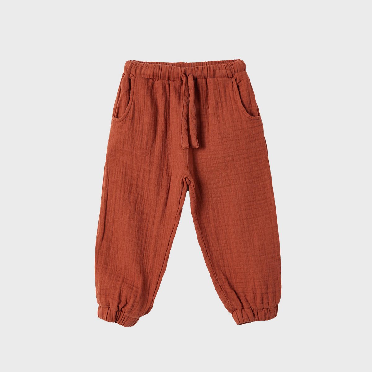 Rostfarbene Bio Musselin Kinderhose aus GOTS Bio-Baumwolle