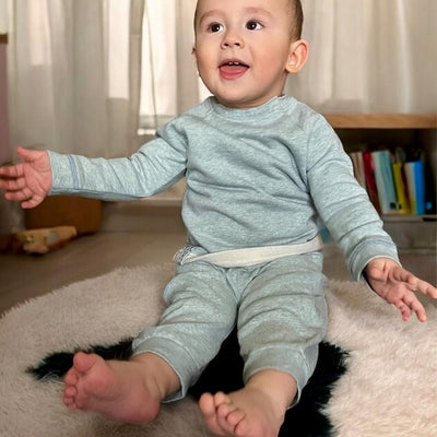 Bio Baumwoll Baby Sweatshirt in Aqua Melange mit sichtbaren Druckknöpfen